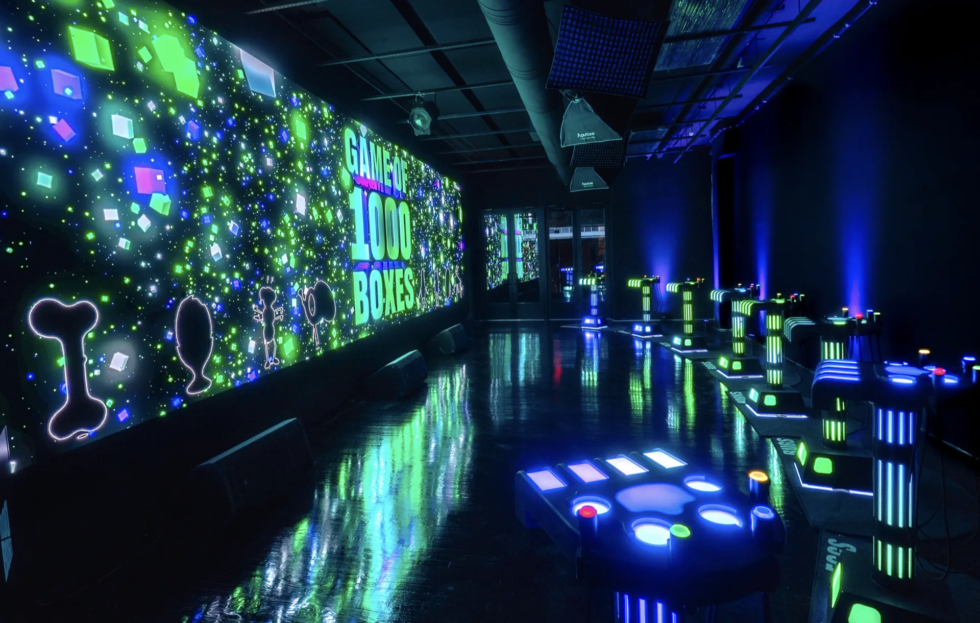 The 40ft LED wall and game show podiums at 1000 Boxes, 302 Bowery